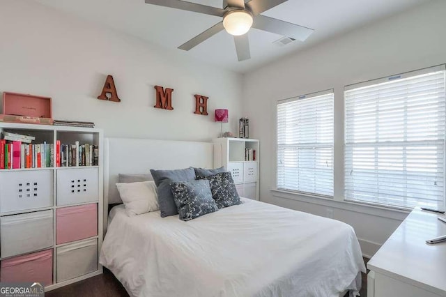 bedroom featuring ceiling fan and visible vents