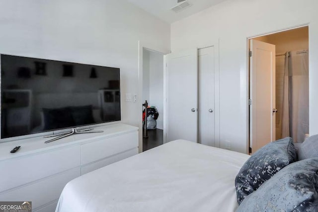 bedroom with visible vents and a closet