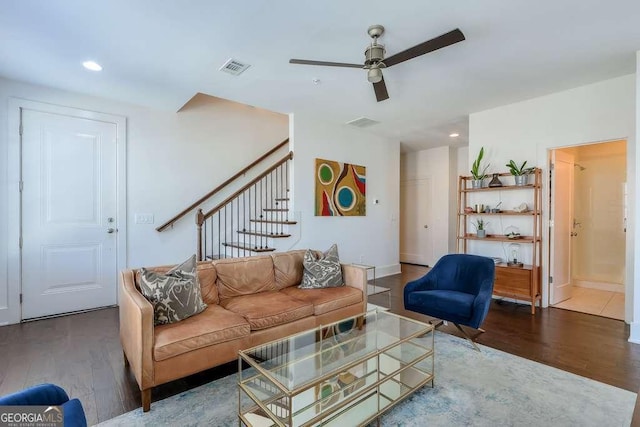 living area featuring stairs, recessed lighting, ceiling fan, and wood finished floors