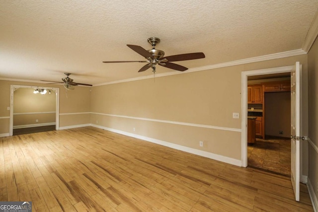 1100 Atlantic Ave, Waycross, GA 31501 - unfurnished room with a ceiling fan, light wood-style flooring, a textured ceiling, and ornamental molding
