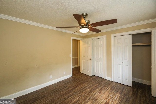 1100 Atlantic Ave, Waycross, GA 31501 - unfurnished bedroom featuring multiple closets, wood finished floors, ornamental molding, a textured ceiling, and ceiling fan