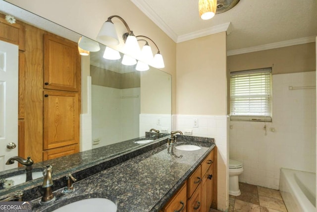 1100 Atlantic Ave, Waycross, GA 31501 - bathroom with tile walls, double vanity, crown molding, and a wainscoted wall