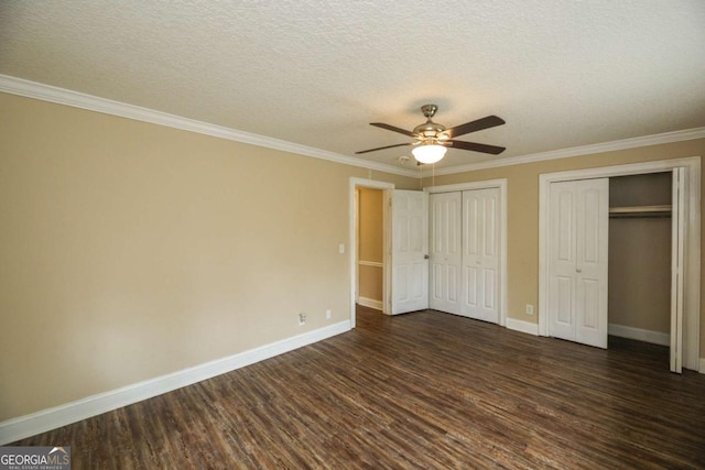 1100 Atlantic Ave, Waycross, GA 31501 - unfurnished bedroom with dark wood-type flooring, multiple closets, crown molding, a textured ceiling, and ceiling fan