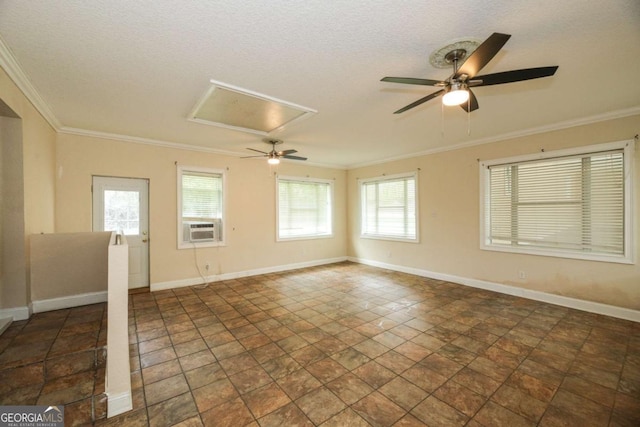 1100 Atlantic Ave, Waycross, GA 31501 - spare room featuring ceiling fan, healthy amount of natural light, ornamental molding, dark stone finish flooring, and a textured ceiling