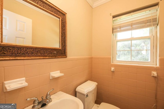 1100 Atlantic Ave, Waycross, GA 31501 - half bathroom with tile walls, a wainscoted wall, and ornamental molding