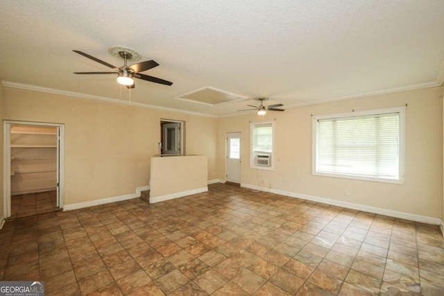 1100 Atlantic Ave, Waycross, GA 31501 - empty room with a ceiling fan, a textured ceiling, crown molding, cooling unit, and stone finish floors