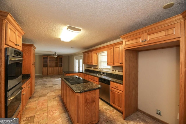 1100 Atlantic Ave, Waycross, GA 31501 - kitchen with stainless steel appliances, ceiling fan, a kitchen island, decorative backsplash, and brown cabinets
