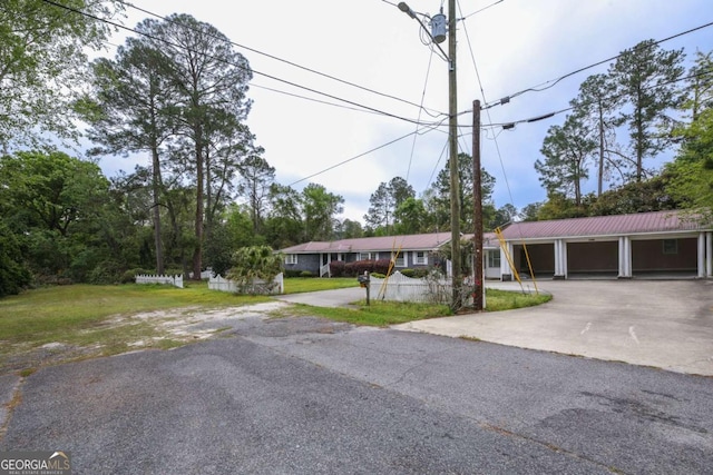1100 Atlantic Ave, Waycross, GA 31501 - ranch-style home with asphalt driveway and a front lawn