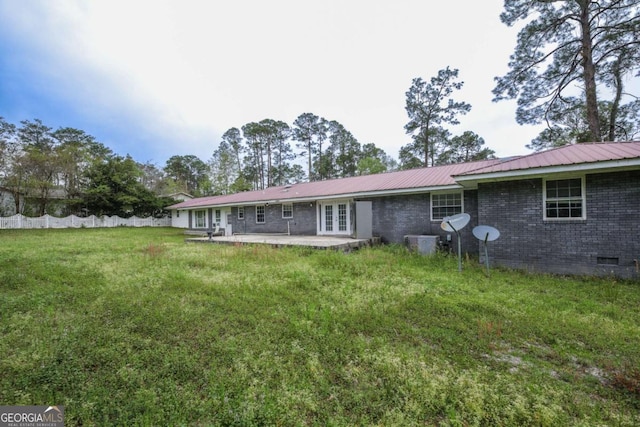 1100 Atlantic Ave, Waycross, GA 31501 - rear view of house featuring french doors, crawl space, a metal roof, a patio area, and brick siding