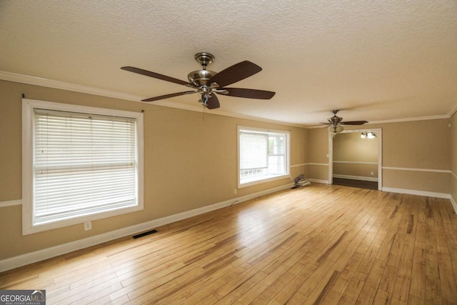 1100 Atlantic Ave, Waycross, GA 31501 - unfurnished room featuring a ceiling fan, crown molding, light wood finished floors, and a textured ceiling