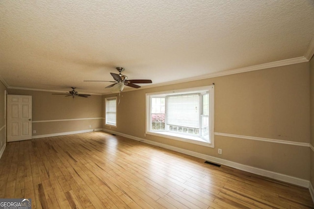 1100 Atlantic Ave, Waycross, GA 31501 - spare room featuring a textured ceiling, hardwood / wood-style flooring, crown molding, and a ceiling fan