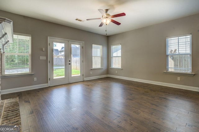 interior space with french doors, baseboards, a ceiling fan, and visible vents