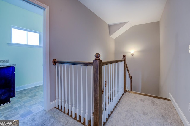 staircase featuring baseboards