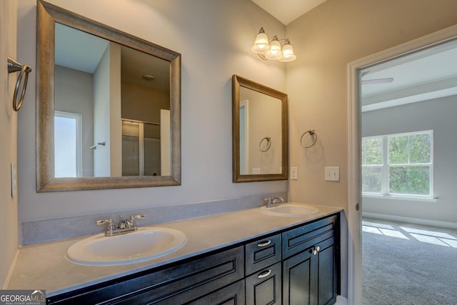full bathroom featuring a sink and double vanity