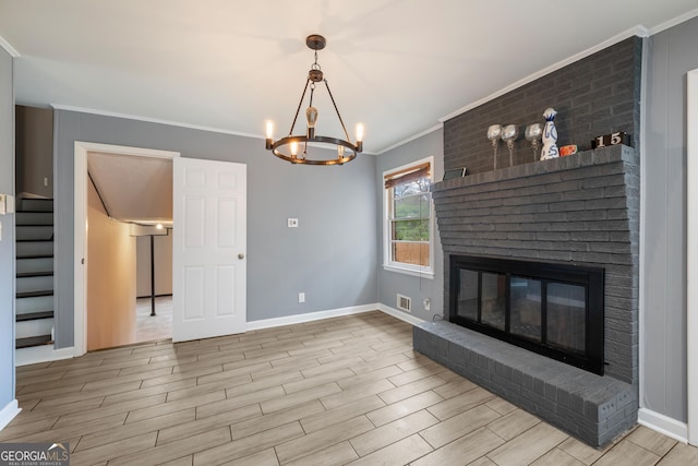 4329 Cedar Valley Ln, Conley, GA 30288 - unfurnished living room with stairs, ornamental molding, wood finished floors, a chandelier, and a fireplace