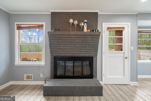 4329 Cedar Valley Ln, Conley, GA 30288 - detailed view of wood tiled floors, ornamental molding, and a brick fireplace