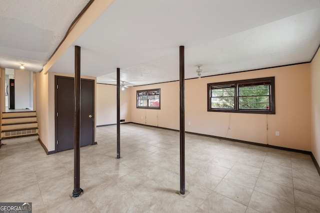 4329 Cedar Valley Ln, Conley, GA 30288 - below grade area with healthy amount of natural light, stairs, and light tile patterned flooring