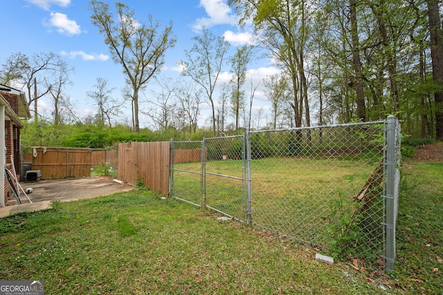 4329 Cedar Valley Ln, Conley, GA 30288 - view of yard with a gate and a patio