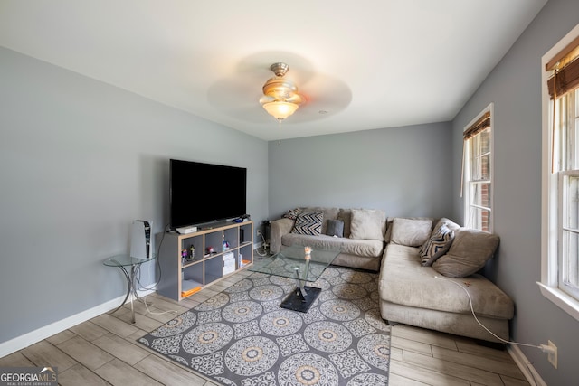 4329 Cedar Valley Ln, Conley, GA 30288 - living room featuring a ceiling fan, wood tiled floors, and plenty of natural light