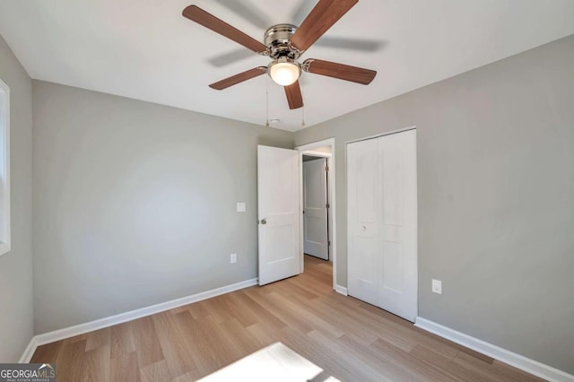 3650 Clovis Ct NW, Atlanta, GA 30331 - unfurnished bedroom with a ceiling fan, a closet, baseboards, and light wood-style floors