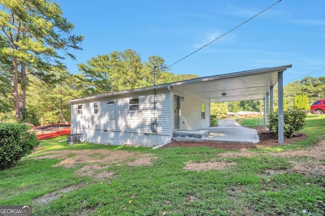 3650 Clovis Ct NW, Atlanta, GA 30331 - rear view of property featuring crawl space, a carport, a yard, and a patio area