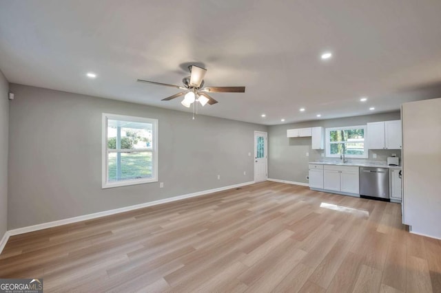 3650 Clovis Ct NW, Atlanta, GA 30331 - kitchen featuring light countertops, light wood-style flooring, dishwasher, a ceiling fan, and white cabinetry