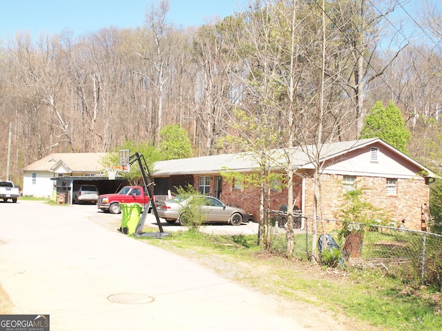 124 Dublin Way, Dalton, GA 30720 - ranch-style home featuring an attached carport, brick siding, fence, and driveway