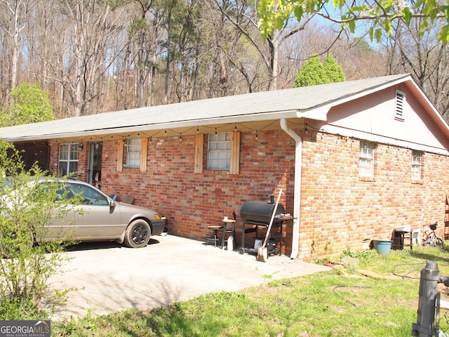 124 Dublin Way, Dalton, GA 30720 - exterior space with brick siding, a yard, and a patio
