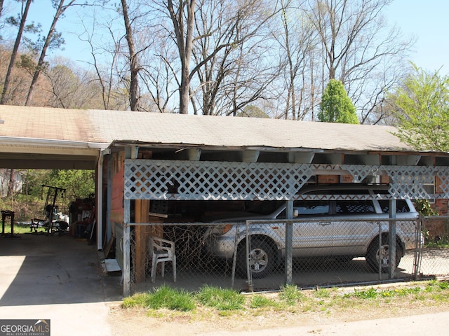 124 Dublin Way, Dalton, GA 30720 - view of parking featuring an attached carport and fence