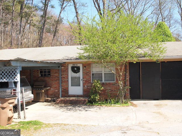 124 Dublin Way, Dalton, GA 30720 - ranch-style home with brick siding, concrete driveway, and an attached carport