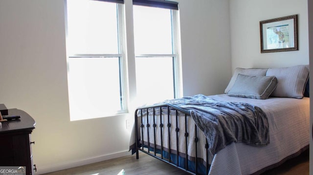 201 Huntington Pl, Dahlonega, GA 30533 - bedroom featuring multiple windows and wood finished floors