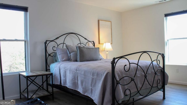 201 Huntington Pl, Dahlonega, GA 30533 - bedroom featuring multiple windows and wood finished floors