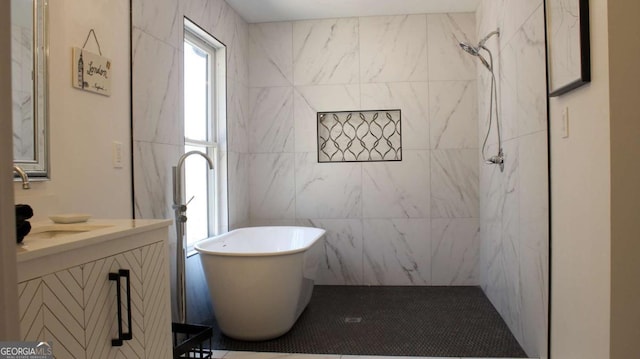 201 Huntington Pl, Dahlonega, GA 30533 - bathroom with vanity, a soaking tub, a tile shower, and tile walls
