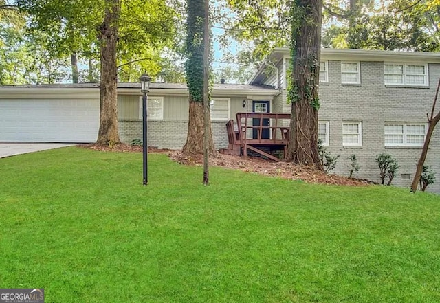 518 Hammett Dr, Decatur, GA 30032 - view of front of home featuring a wooden deck, an attached garage, a front yard, brick siding, and driveway