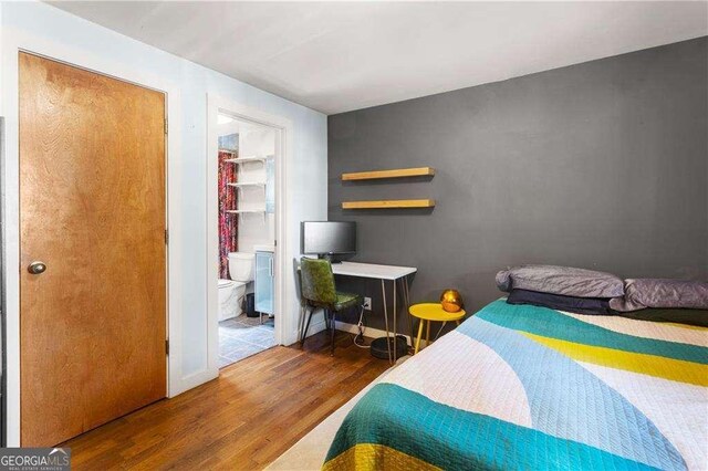 562 Formwalt St SW Unit 5, Atlanta, GA 30312 - bedroom with baseboards and wood finished floors