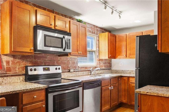 562 Formwalt St SW Unit 5, Atlanta, GA 30312 - kitchen with a sink, stainless steel appliances, and brown cabinets