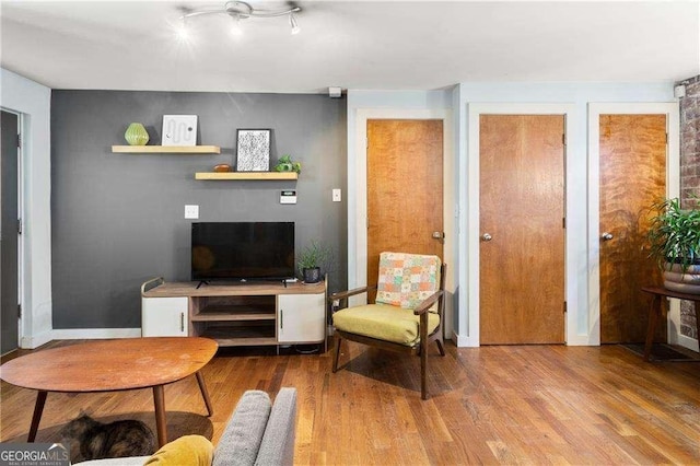 562 Formwalt St SW Unit 5, Atlanta, GA 30312 - living room featuring baseboards and wood finished floors