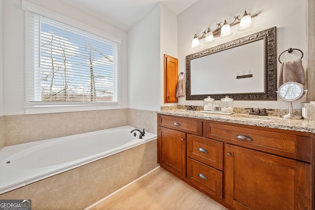 2442 Lower Union Hill Rd, Canton, GA 30115 - full bathroom featuring double vanity, a bath, and wood finished floors