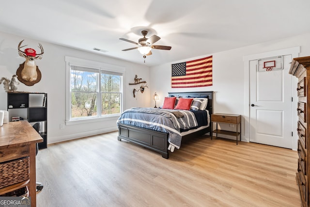 2442 Lower Union Hill Rd, Canton, GA 30115 - bedroom with light wood-style floors, an office area, and a ceiling fan