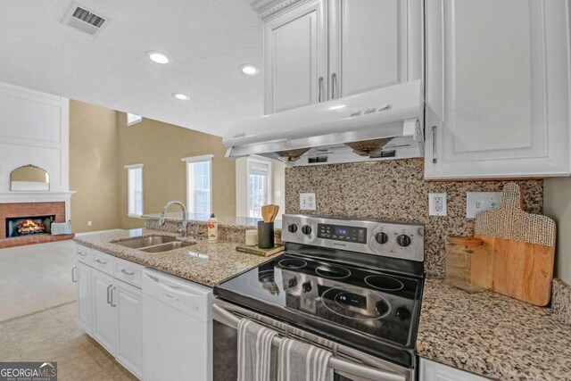 2983 Bancroft Gln NW, Kennesaw, GA 30144 - kitchen featuring electric stove, dishwasher, under cabinet range hood, tasteful backsplash, and white cabinetry