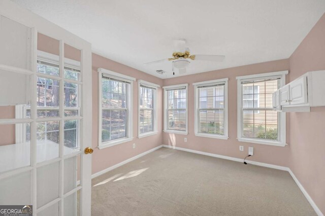 2983 Bancroft Gln NW, Kennesaw, GA 30144 - unfurnished sunroom with baseboards and carpet flooring