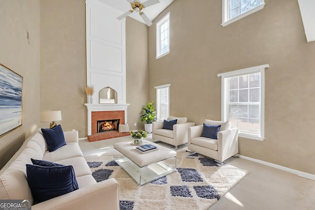 2983 Bancroft Gln NW, Kennesaw, GA 30144 - carpeted living room with a high ceiling, ceiling fan, and a fireplace