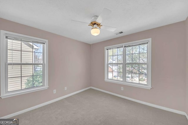 2983 Bancroft Gln NW, Kennesaw, GA 30144 - carpeted spare room featuring baseboards and a ceiling fan