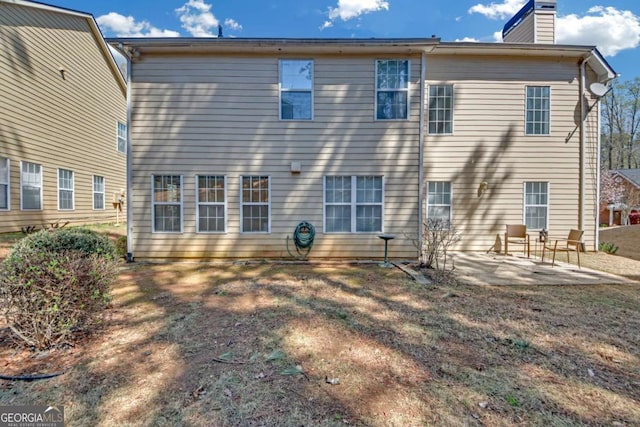 2983 Bancroft Gln NW, Kennesaw, GA 30144 - back of property featuring a patio area and a chimney