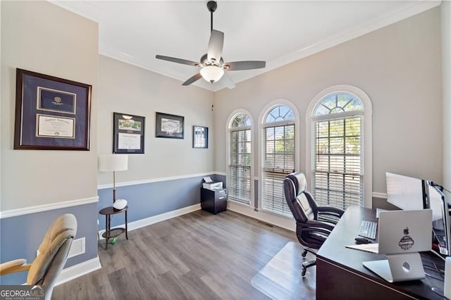 office with wood finished floors, ornamental molding, ceiling fan, and baseboards