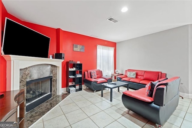 tiled living room with a fireplace
