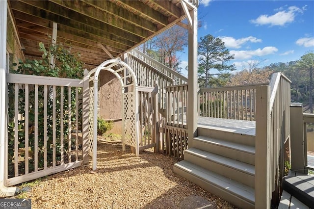 wooden deck featuring stairway
