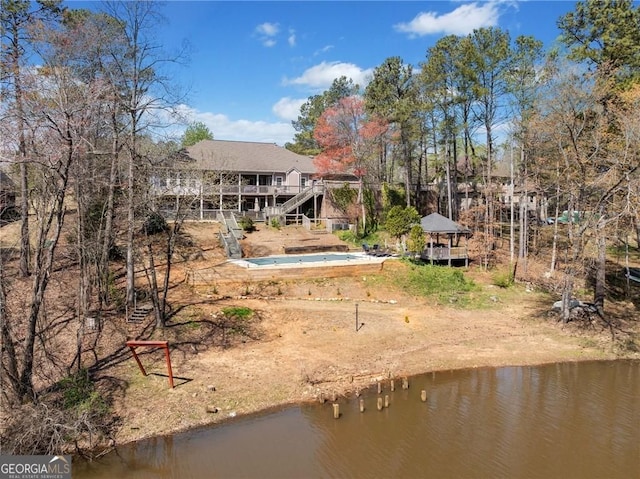 back of house featuring a water view