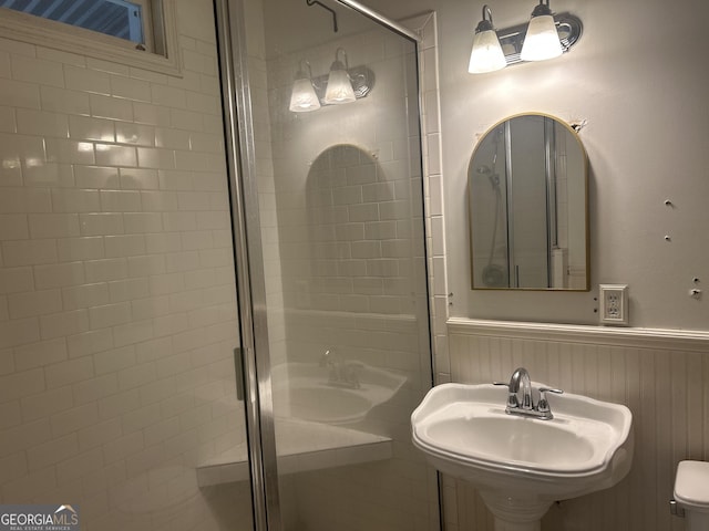 3776 Berkley Dr, Macon, GA 31204 - full bathroom featuring a shower stall, wainscoting, a sink, and toilet