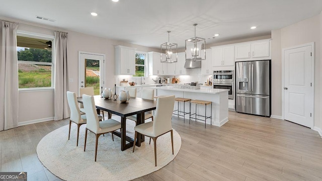 52 Sheryl Way, Loganville, GA 30052 - dining room with recessed lighting and light wood-style flooring